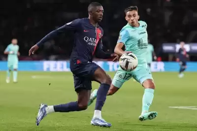 Dembele shines PSG climb top Ligue 1.